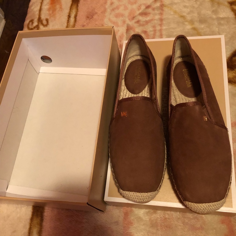 A pair of Michael Kors shoes